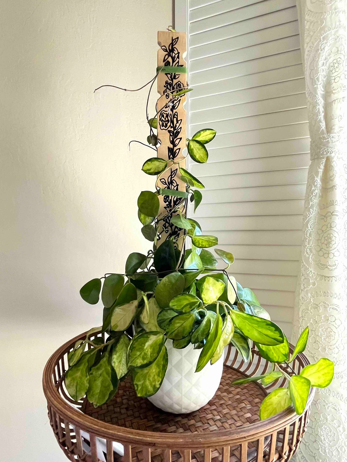 Decorative plant stake carved in wood