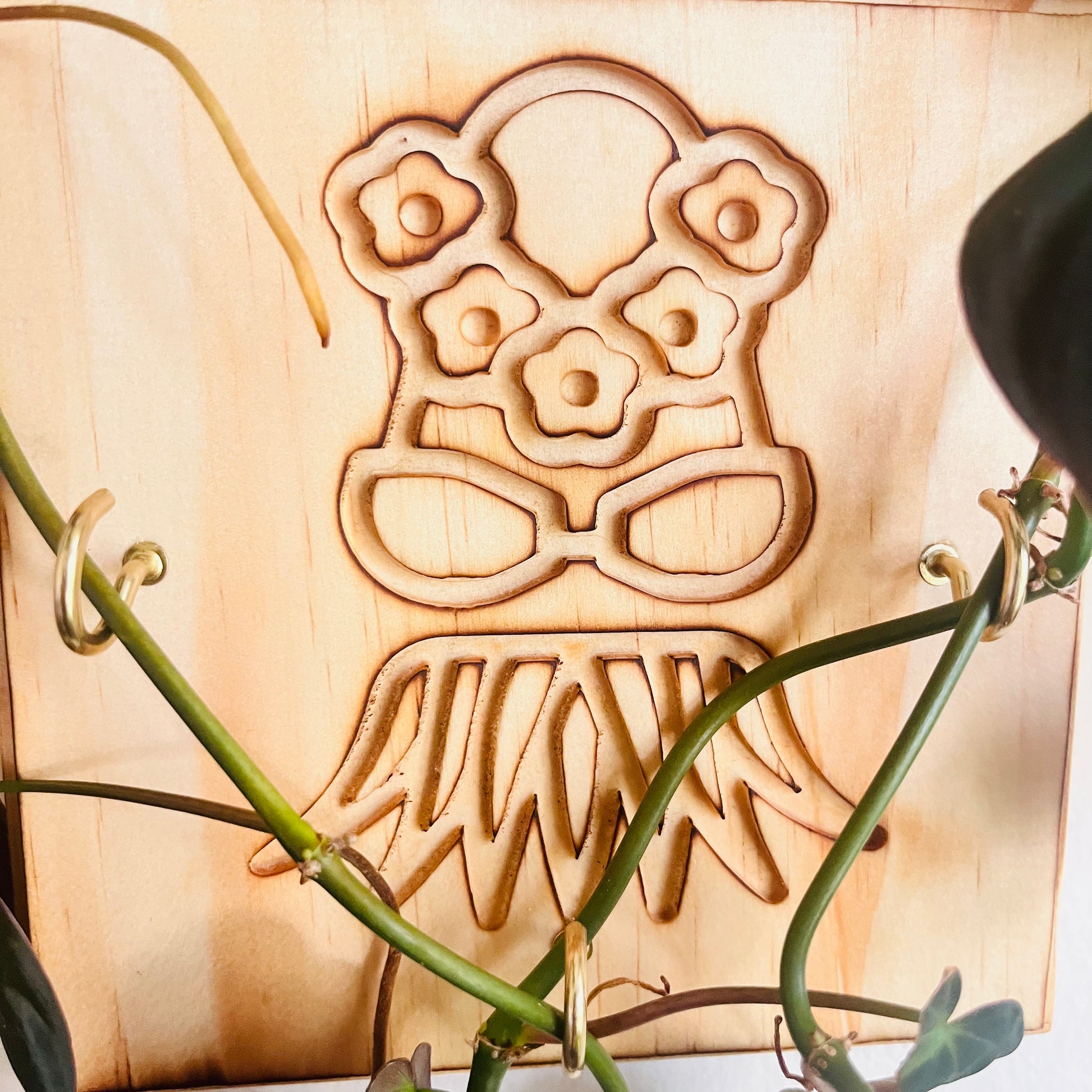 Wooden_wall_trellis_for_plants_or key holder with_Hawaii Hula design closeup