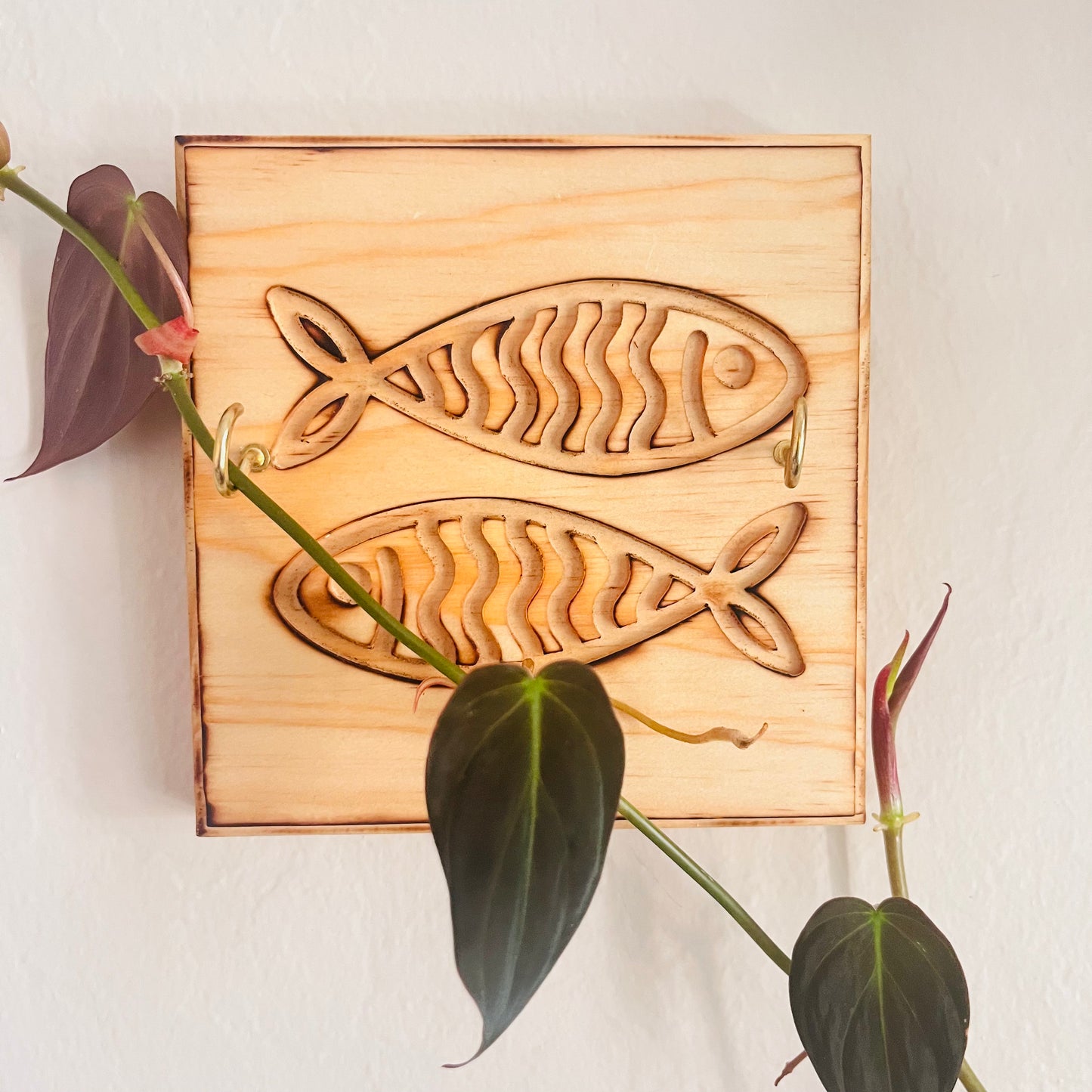 Wooden wall trellis for plants with fish design 