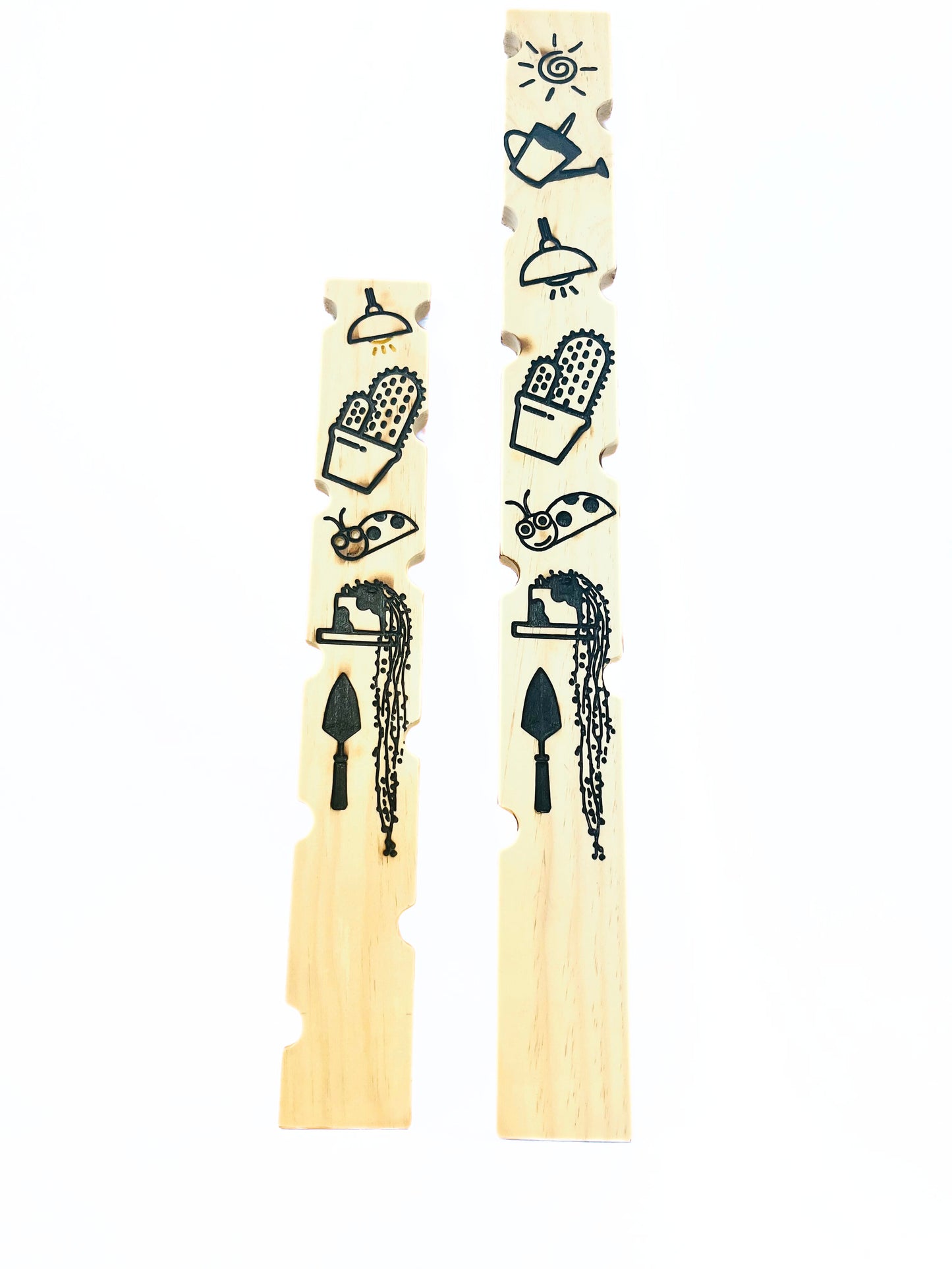 plant stakes 24 inch and 30 inches long with fun images on the back