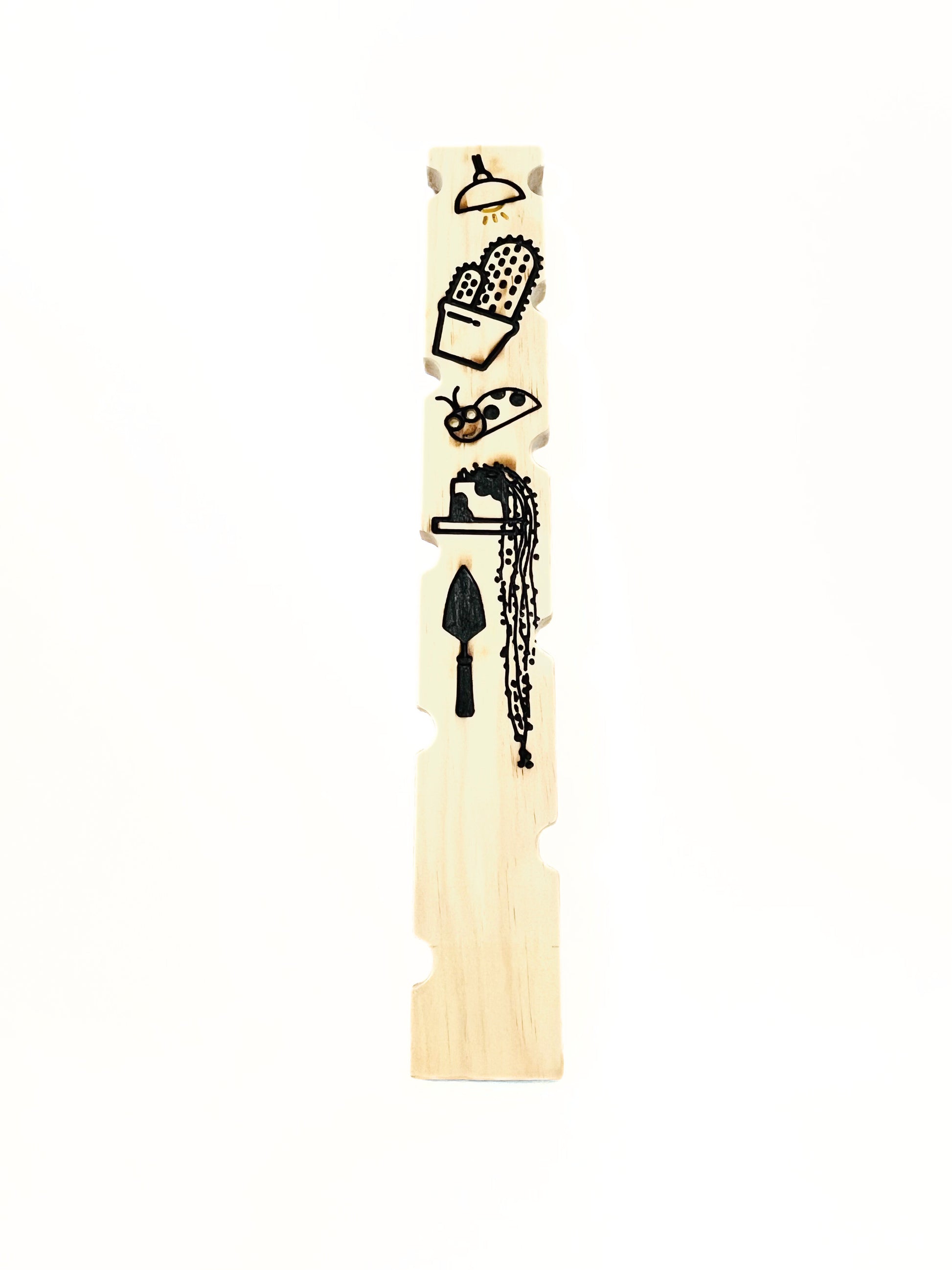 Carved wooden plant stake back view
